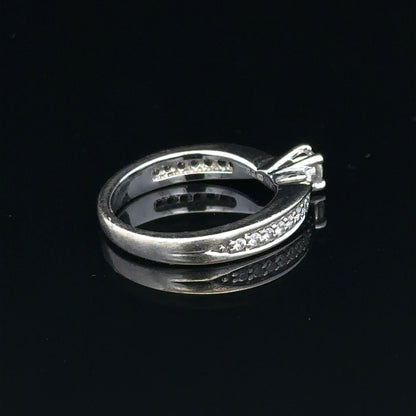 18ct white gold diamond ring with 1/3 carat center stone, size J, featuring a delicate sparkling design.