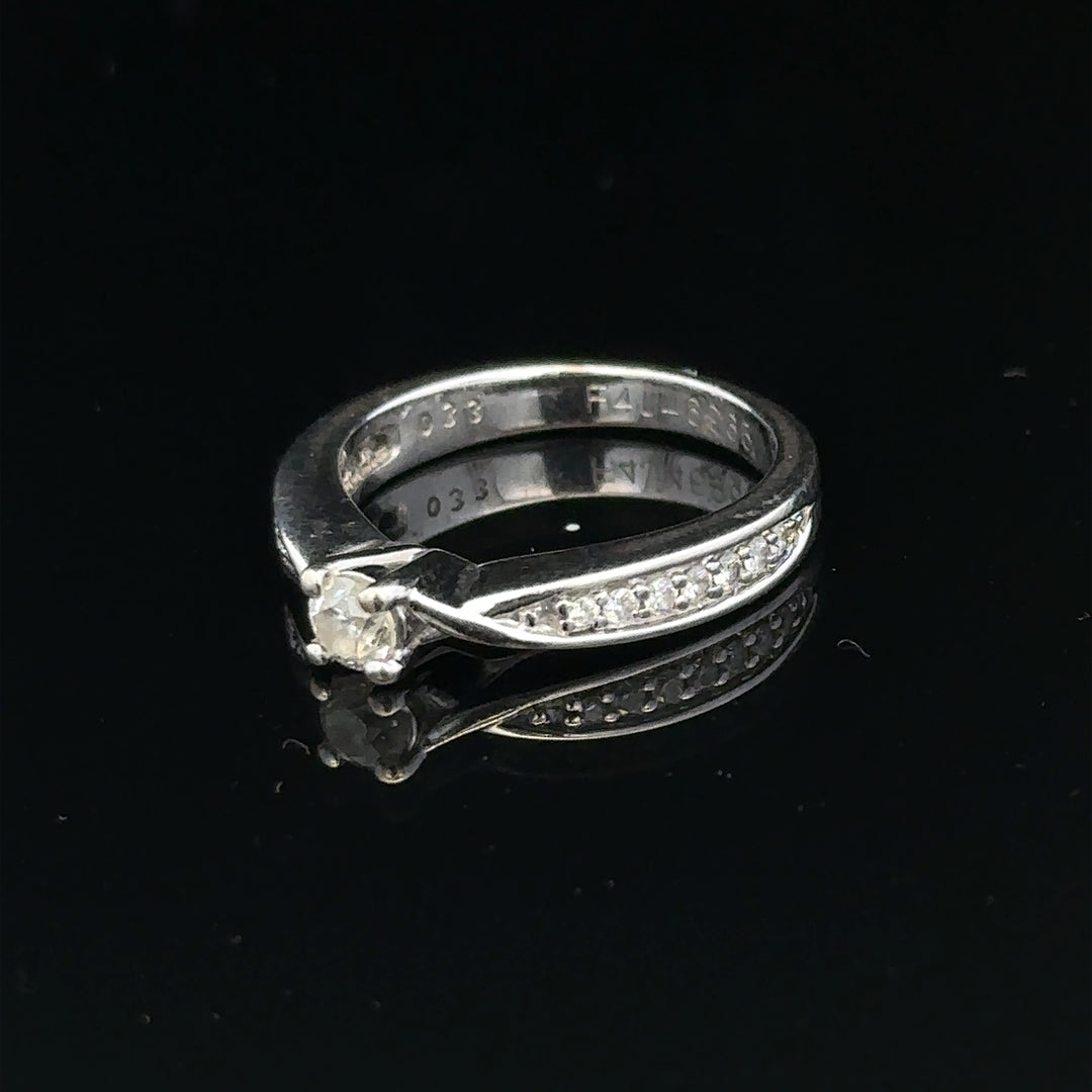 18ct white gold diamond ring with 1/3 carat solitaire, size J, featuring a sparkling diamond setting.