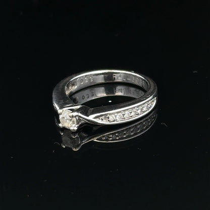 18ct white gold diamond ring with 1/3 carat solitaire, size J, featuring a sparkling diamond setting.