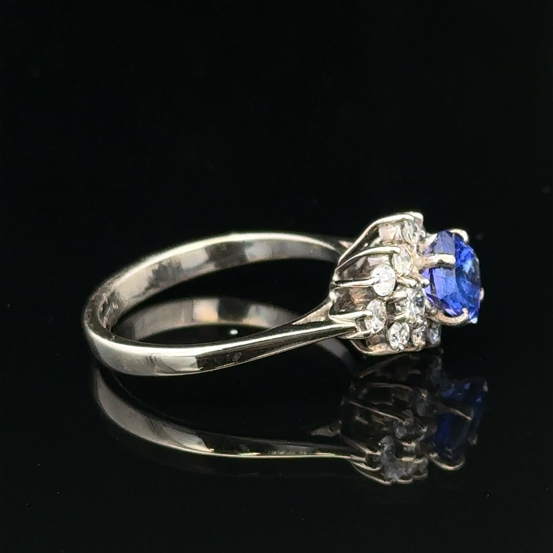18ct white gold diamond and tanzanite ring in size O, featuring a sparkling central tanzanite surrounded by diamonds.