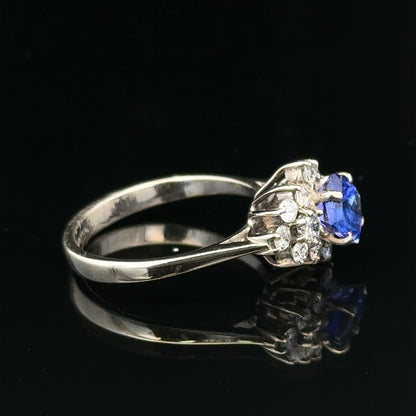 18ct white gold diamond and tanzanite ring in size O, featuring a sparkling central tanzanite surrounded by diamonds.