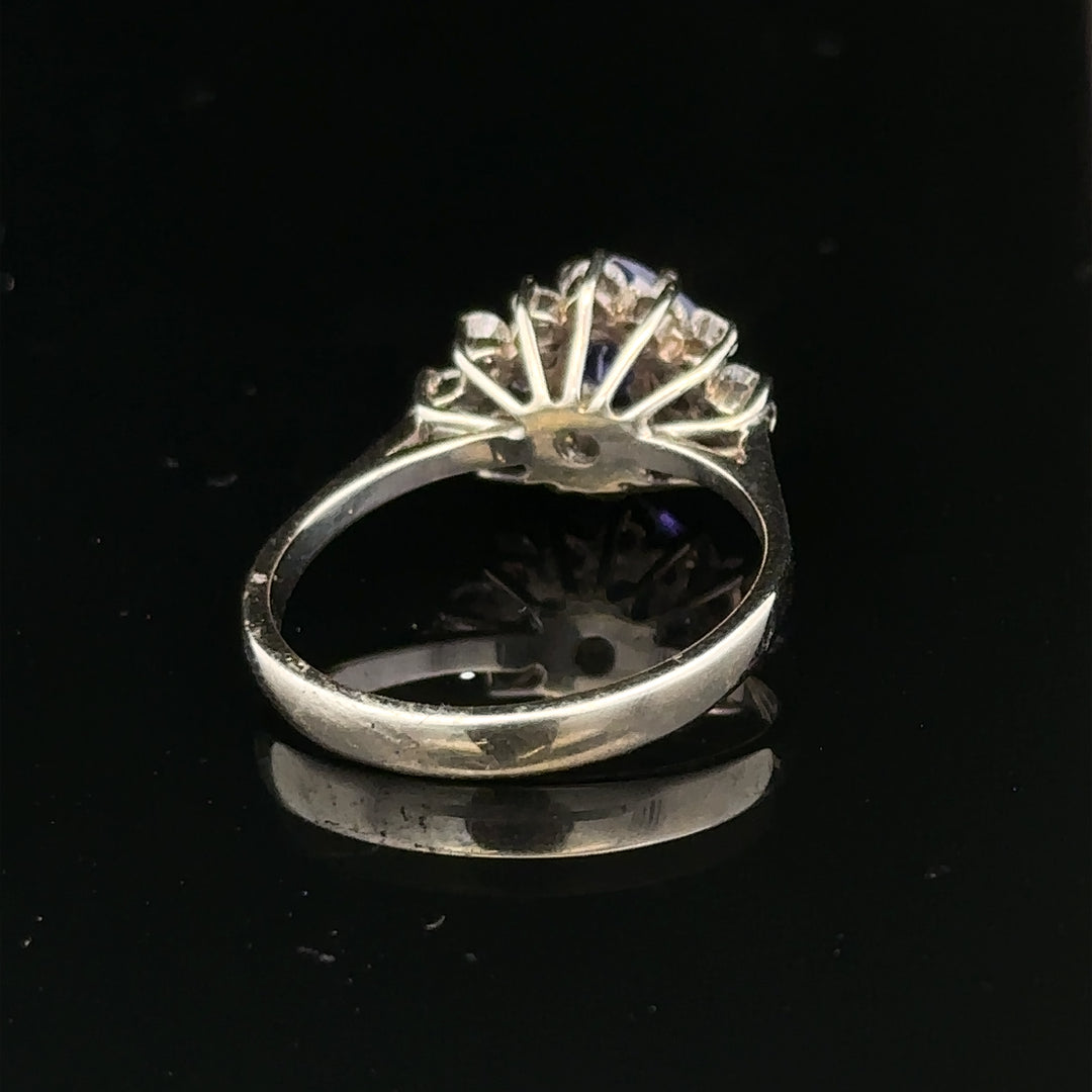18ct white gold diamond and tanzanite ring in size O, featuring a sparkling gemstone design with intricate detailing.