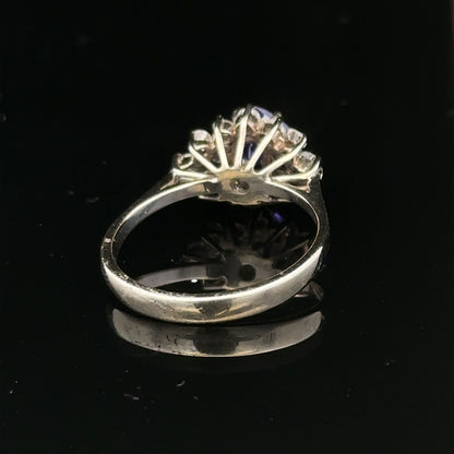 18ct white gold diamond and tanzanite ring in size O, featuring a sparkling gemstone design with intricate detailing.