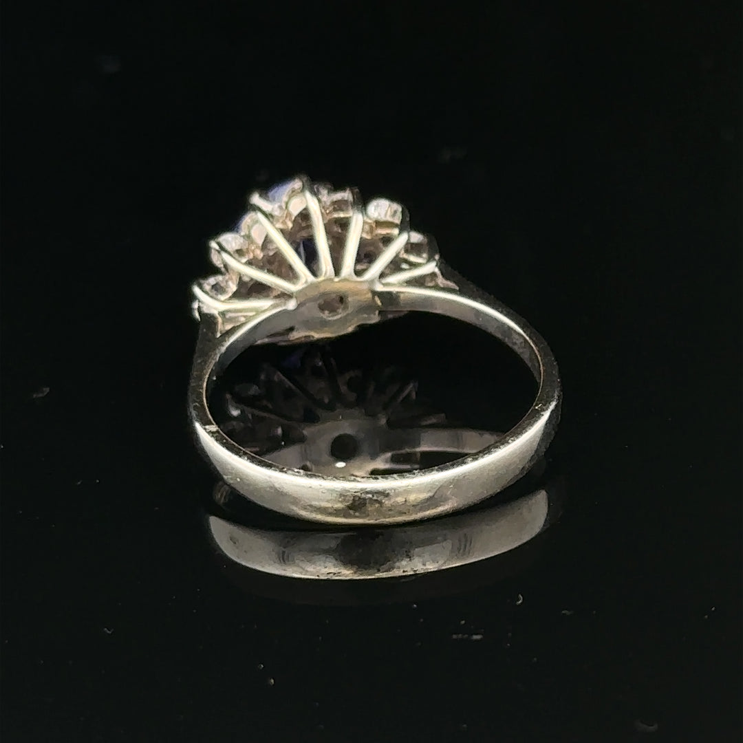 18ct white gold diamond and tanzanite ring, size O, featuring a sparkling central tanzanite gemstone with surrounding diamonds.