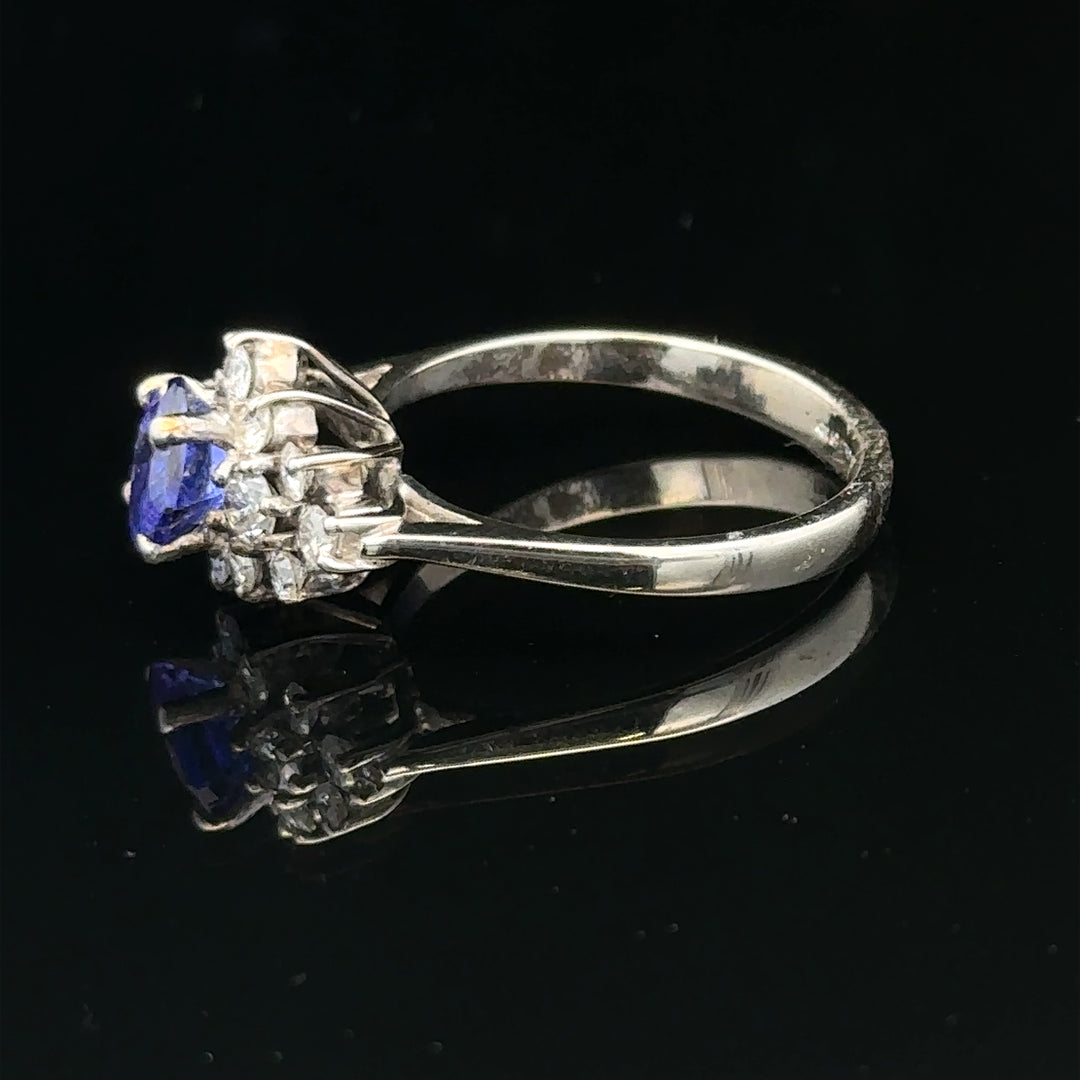 18ct white gold diamond and tanzanite ring in size O, featuring sparkling gemstones and elegant craftsmanship.