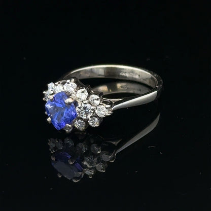 18ct white gold diamond and tanzanite ring in size O with sparkling gemstones and intricate band detail.