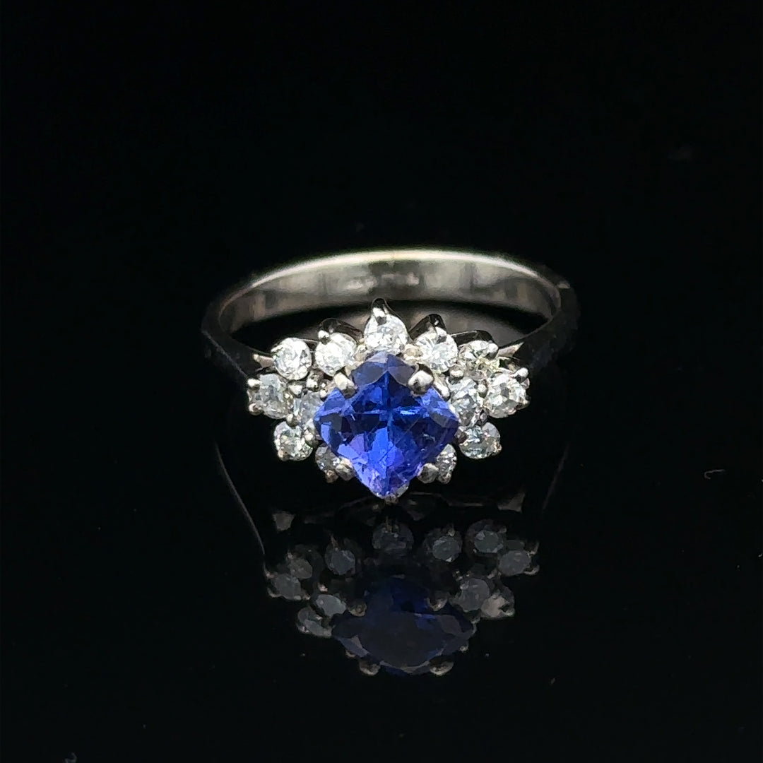 18ct white gold diamond and tanzanite ring, size O, featuring a central tanzanite gemstone surrounded by sparkling diamonds.
