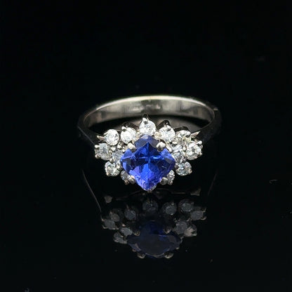 18ct white gold diamond and tanzanite ring, size O, featuring a central tanzanite gemstone surrounded by sparkling diamonds.
