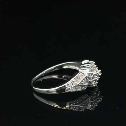 9ct white gold diamond ring in size M, featuring sparkling diamonds and a sleek band, weighing 2.6 grams.