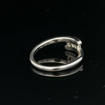 18ct white gold diamond ring in size M.5 with sparkling diamonds, weighing 4.2g, showcasing a elegant and timeless jewelry design.