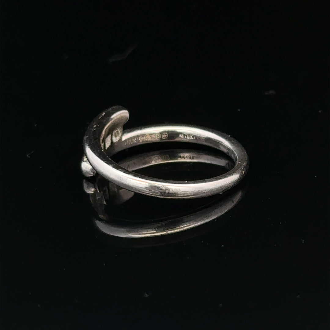 18ct white gold diamond ring in size M.5 with 4.2g, showcasing a sparkling diamond design on a polished band.