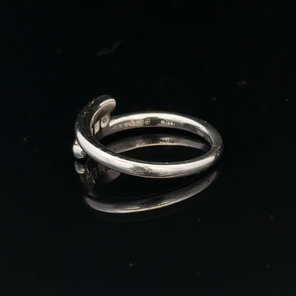 18ct white gold diamond ring in size M.5 with 4.2g, showcasing a sparkling diamond design on a polished band.