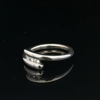 18ct white gold diamond ring in size M.5, featuring sparkling diamonds and a sleek band, weighs 4.2 grams.