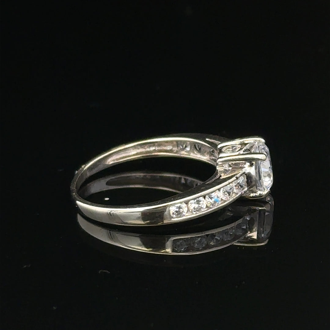 9ct white gold ring in size L 1/2, weighing 2g, displayed on a plain background, showcasing its polished band and simple design.