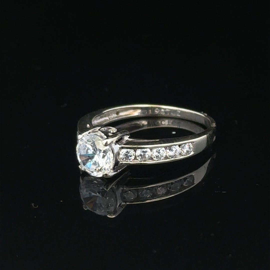 9ct white gold ring in size L 1/2, weighing 2g, featuring a sleek, polished band with a simple, elegant design.