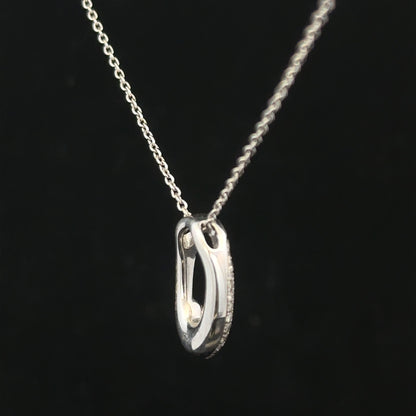 9ct white gold chain with a white gold and diamond pendant, showcasing a elegant jewelry design.