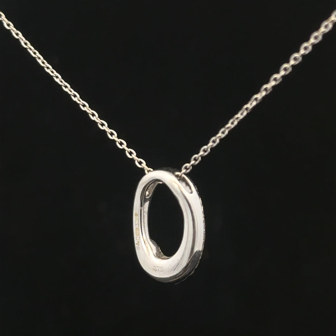 9ct white gold chain with a white gold and diamond pendant, showcasing elegant jewelry design and sparkling gemstone detail.