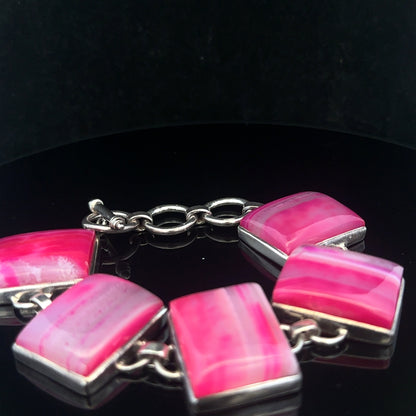Silver gemstone bracelet with polished beads and intricate design, showcasing a stylish accessory for elegant wristwear.