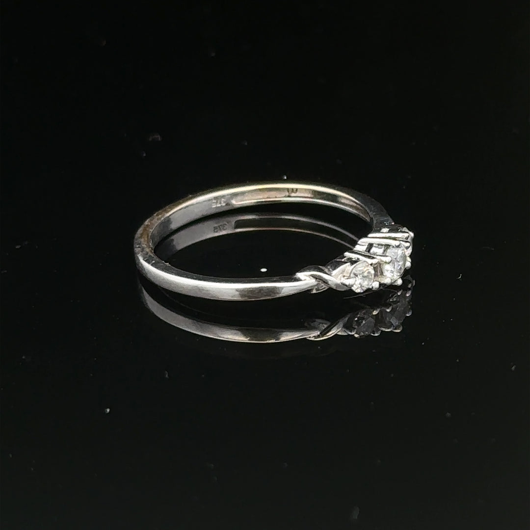 9ct white gold diamond ring in size Q1/2, featuring a sparkling diamond centerpiece and delicate band design.