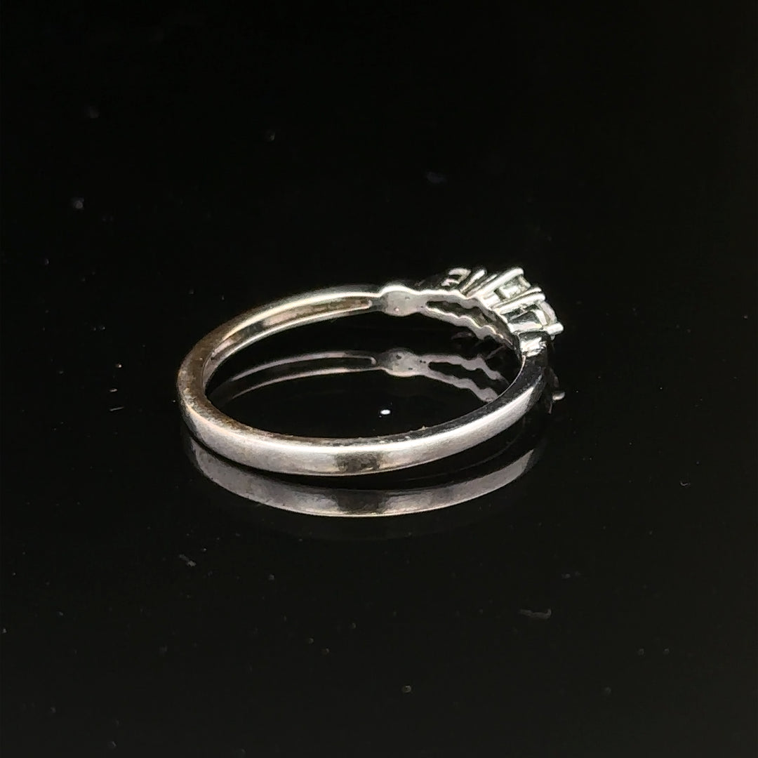 9ct white gold diamond ring size Q1/2 with sparkling diamonds, showcasing intricate design and elegant craftsmanship.