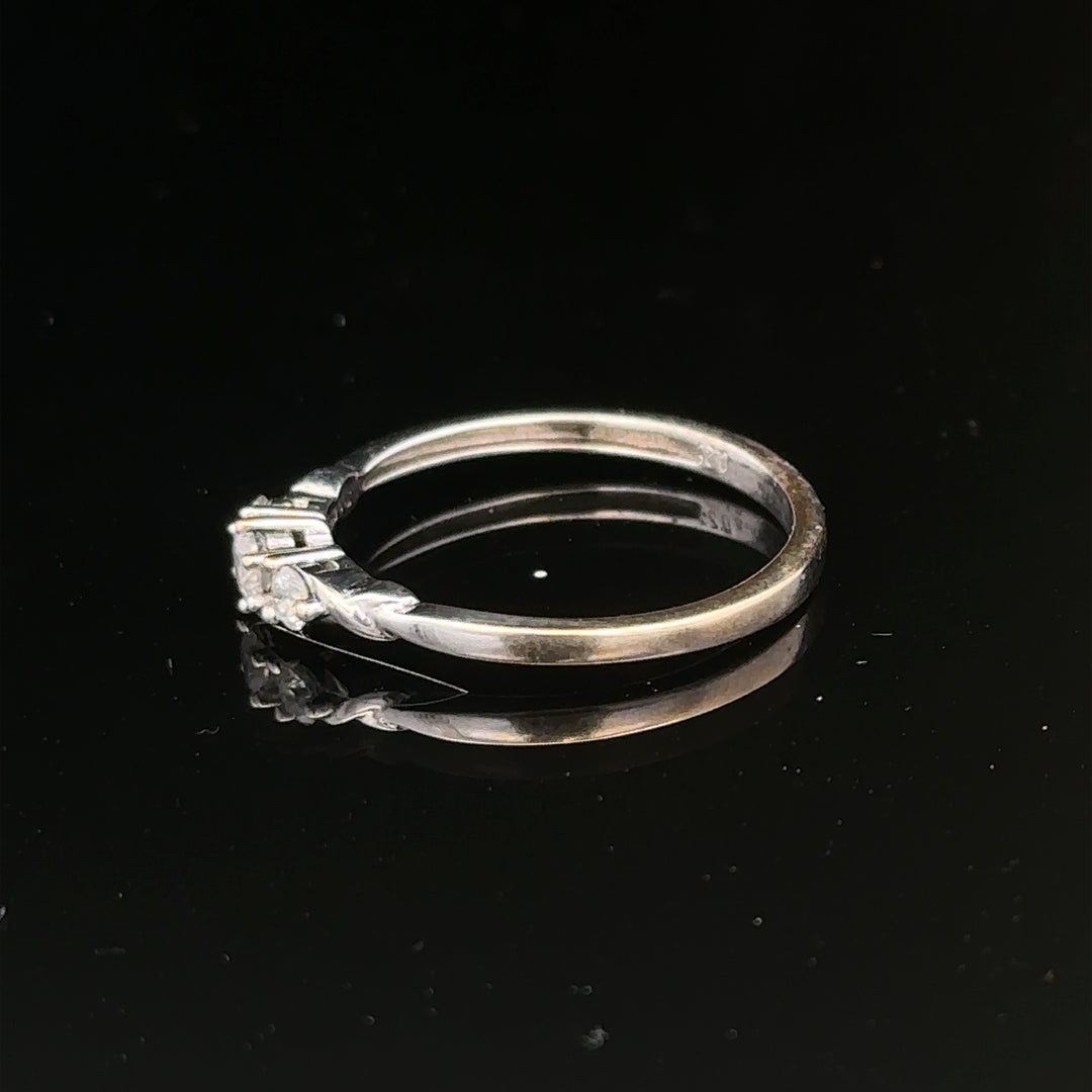 9ct white gold diamond ring size Q1/2 with sparkling diamonds, featuring a sleek band and elegant design.