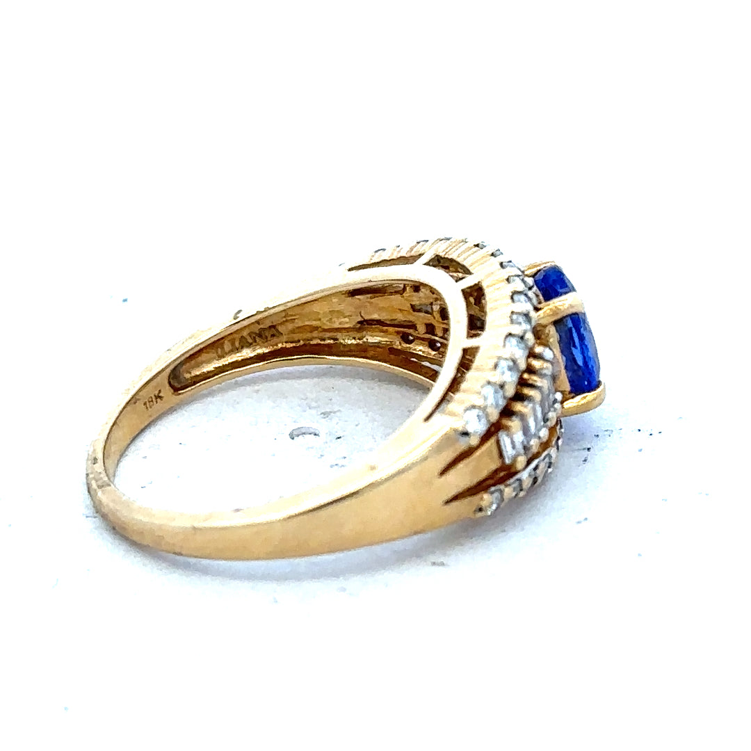 18ct yellow gold diamond and tanzanite ring in size N1/2, featuring a detailed design with sparkling gemstones.
