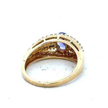 18ct yellow gold diamond and tanzanite ring in size N1/2, featuring a sparkling gemstone design and elegant craftsmanship.