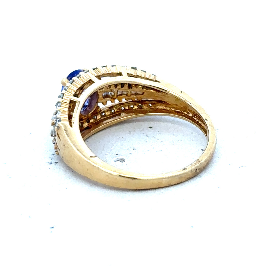 18ct yellow gold diamond and tanzanite ring in size N1/2, featuring a vibrant tanzanite gemstone and sparkling diamonds.