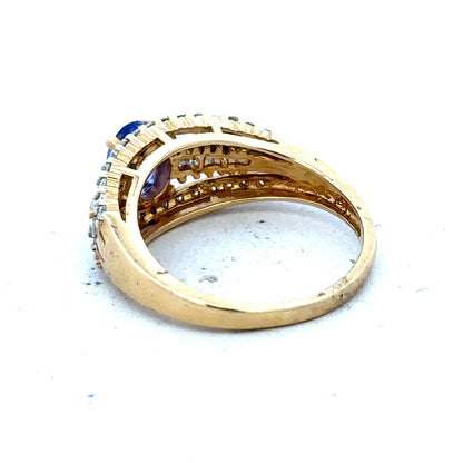 18ct yellow gold diamond and tanzanite ring in size N1/2, featuring a vibrant tanzanite gemstone and sparkling diamonds.