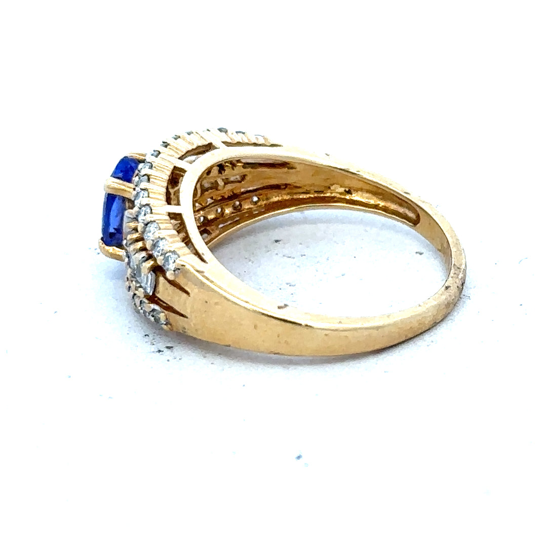 18ct yellow gold ring with diamond and tanzanite gemstones, size N1/2, elegant jewelry piece with intricate design details