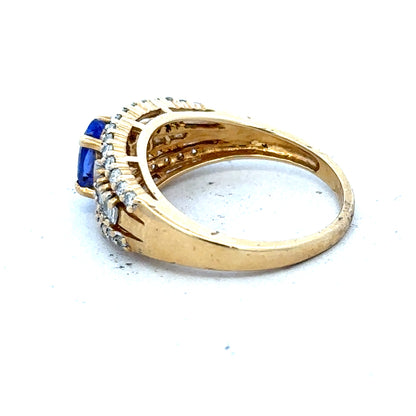 18ct yellow gold ring with diamond and tanzanite gemstones, size N1/2, elegant jewelry piece with intricate design details