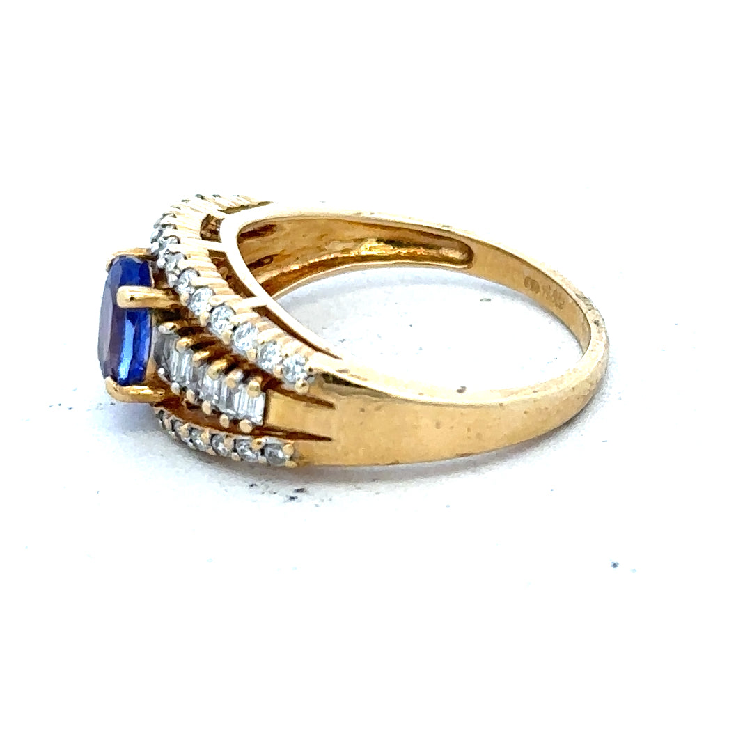 18ct yellow gold ring with diamonds and tanzanite gemstone, size N1/2, showcasing intricate design and sparkling stones.