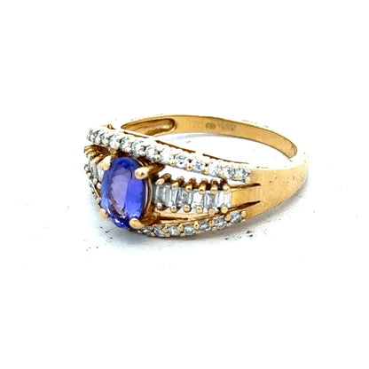 18ct yellow gold ring with diamond and tanzanite gemstones, size N 1/2, featuring intricate design and sparkling stones.