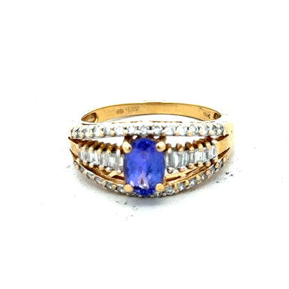 18ct yellow gold diamond and tanzanite ring in size N1/2, showcasing a sparkling gemstone design on a polished band