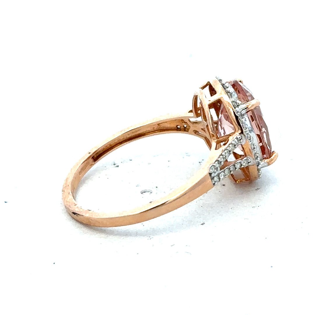 14ct gold Morganite and diamond ring in size S, featuring a sparkling gemstone and elegant design.