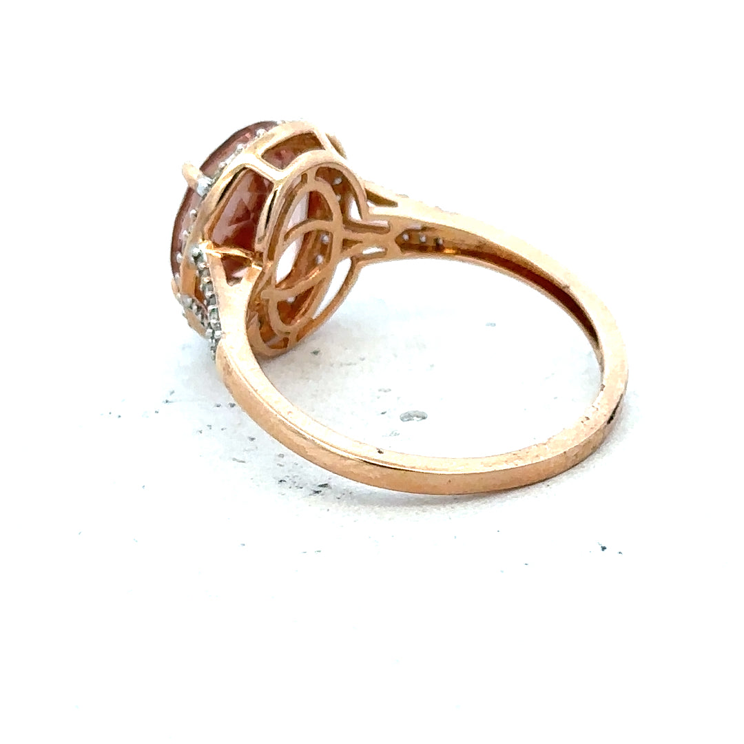 14ct gold Morganite and diamond ring in size S, featuring a sparkling center stone and delicate band design.