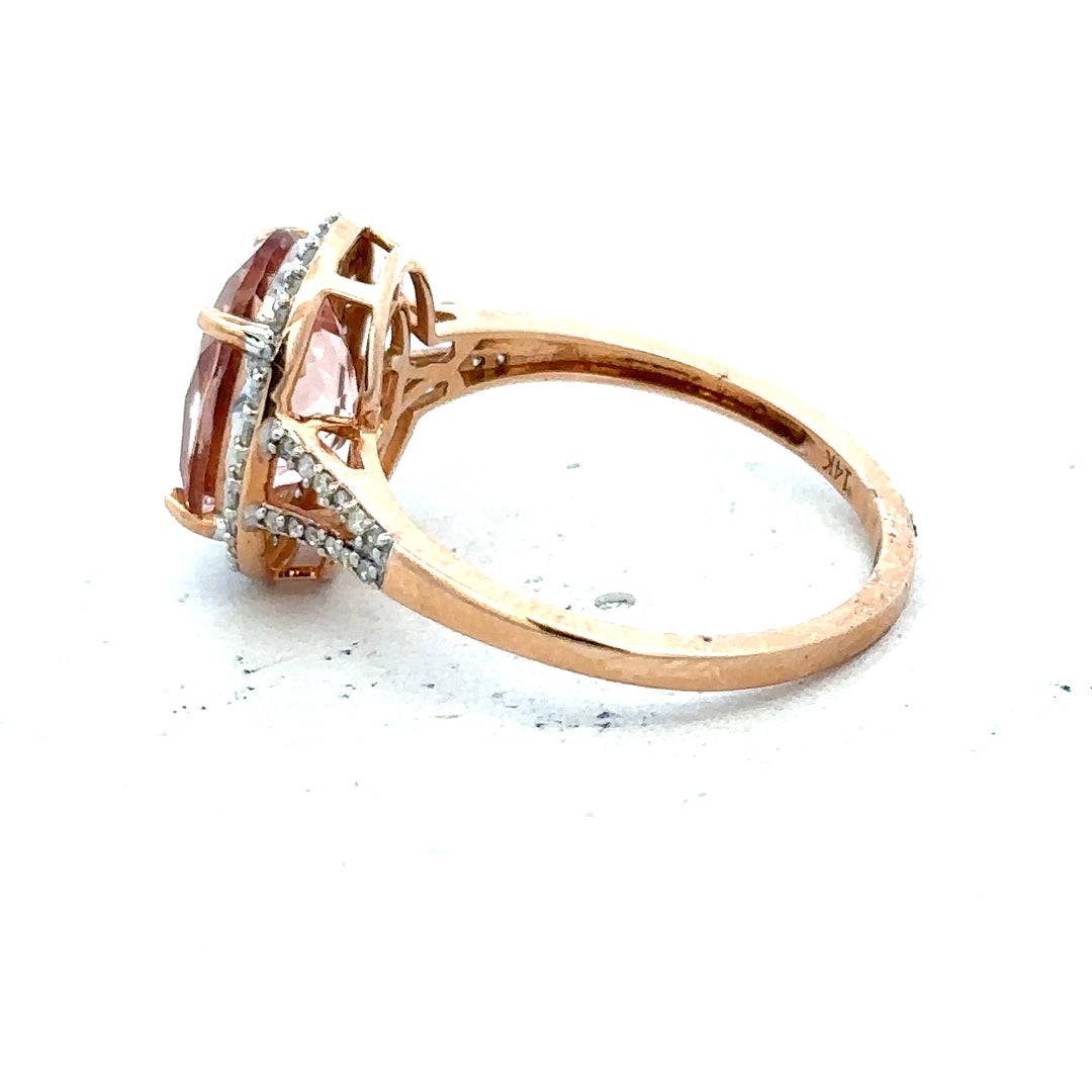 14ct gold Morganite and diamond ring in size S, featuring a sparkling gemstone and elegant design.