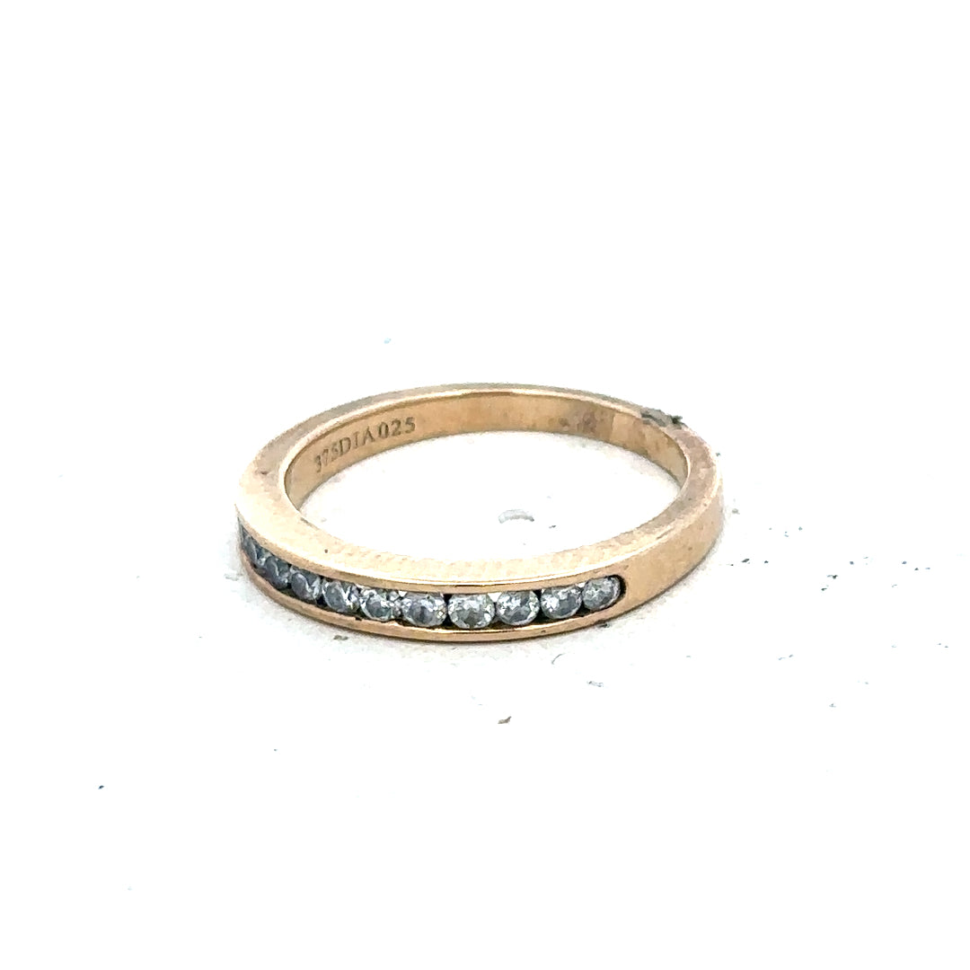 9ct yellow gold diamond ring with 1/4 carat total weight, size J1/2, featuring sparkling diamonds on a sleek band.