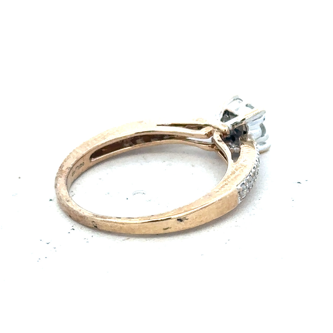 Yellow gold diamond ring in size P, unbranded 9 carats with sparkling diamonds, shown on a white background.
