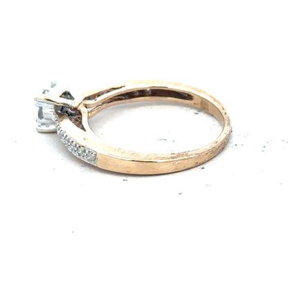 9ct yellow gold diamond ring in size P, featuring a sparkling diamond centerpiece, unbranded jewelry accessory.
