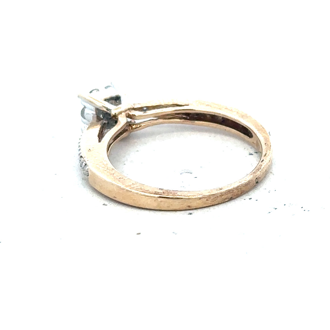9ct yellow gold diamond ring in size P with sparkling diamonds, showcasing elegant jewelry craftsmanship.