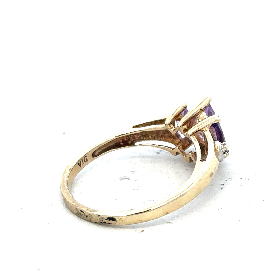 9ct yellow gold amethyst and diamond ring, size P, featuring a central purple gemstone and sparkling accents.