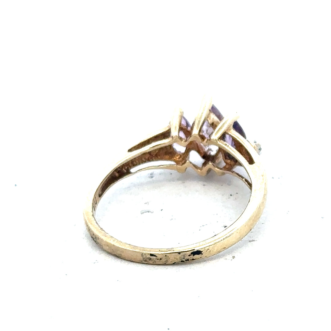 9ct yellow gold amethyst and diamond ring size P, featuring a central purple amethyst gemstone with diamond accents.