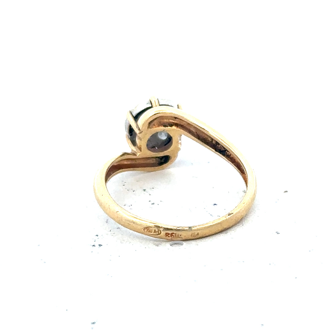 18ct yellow gold diamond ring in size L1/2 with sparkling diamonds, displayed on a neutral background.