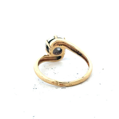 18ct yellow gold diamond ring in size L1/2 with sparkling diamonds, displayed on a neutral background.