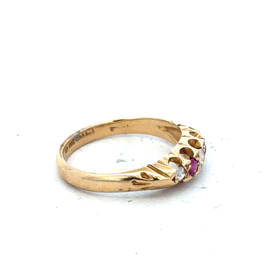 18ct yellow gold diamond and ruby ring in size N, featuring a detailed design with sparkling gemstones.