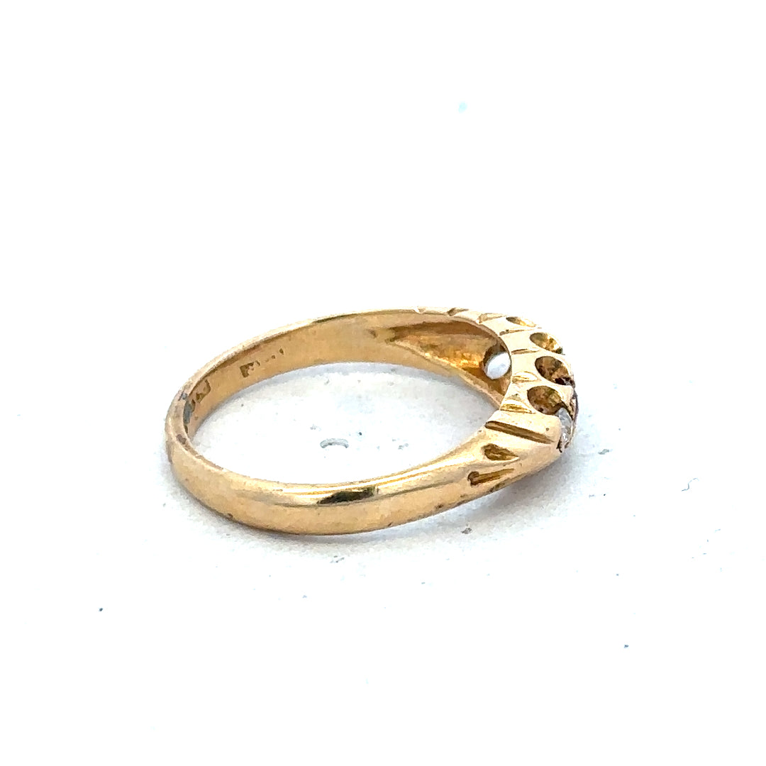 18ct yellow gold diamond and ruby ring in size N, featuring sparkling gemstones and intricate band design.
