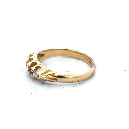 18ct yellow gold ring with diamonds and rubies, size N, featuring elegant gemstone details and a polished finish.