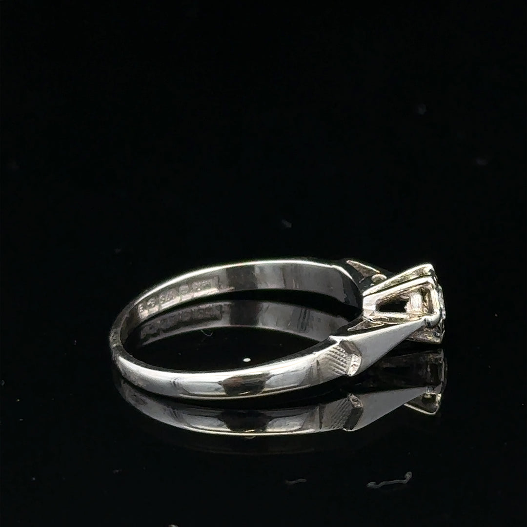 9ct white gold diamond ring with sparkling diamonds, showcasing elegant jewelry design and craftsmanship.