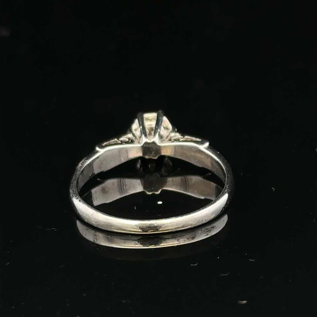 9ct white gold diamond ring with sparkling gemstones, showcasing elegant craftsmanship and a polished finish.
